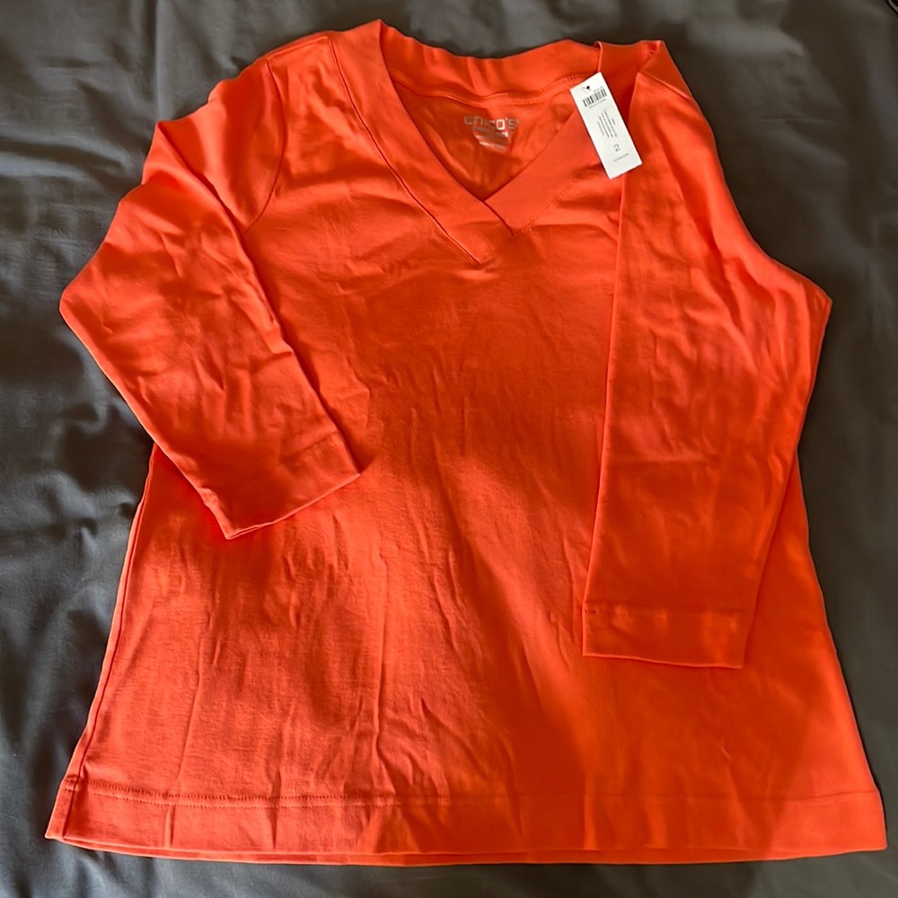 Perfect for fall! Orange, BRAND NEW—never worn—Chico women’s shirt (large).